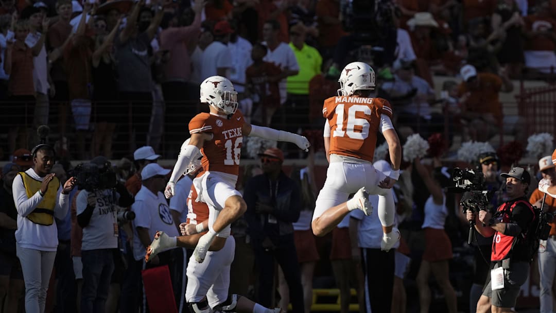 Nov 22, 2025; Austin, Texas, USA; Texas Longhorns quarterback Arch Manning (16) and defensive back Michael Taaffe (16) react after a touchdown during the first half against the Arkansas Razorbacks at Darrell K Royal-Texas Memorial Stadium. Mandatory Credit: Scott Wachter-Imagn Images