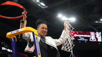 Apr 7, 2024; Cleveland, OH, USA; South Carolina Gamecocks head coach Dawn Staley cuts down the net after defeating the Iowa Hawkeyes in the finals of the Final Four of the womens 2024 NCAA Tournament at Rocket Mortgage FieldHouse. Mandatory Credit: Kirby Lee-USA TODAY Sports