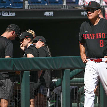 Jun 19, 2023; Omaha, NE, USA;  Stanford Cardinal head coach David Esquer (8) walks in front of the dugout after the loss against the Tennessee Volunteers at Charles Schwab Field Omaha. Mandatory Credit: Steven Branscombe-Imagn Images