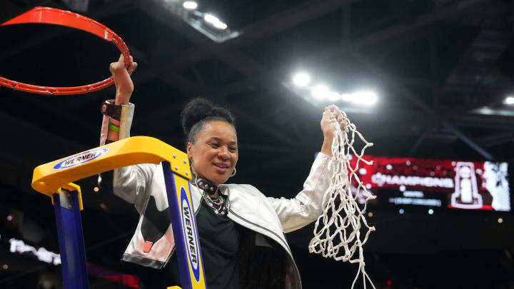 Apr 7, 2024; Cleveland, OH, USA; South Carolina Gamecocks head coach Dawn Staley cuts down the net after defeating the Iowa Hawkeyes in the finals of the Final Four of the womens 2024 NCAA Tournament at Rocket Mortgage FieldHouse. Mandatory Credit: Kirby Lee-USA TODAY Sports