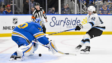 Oct 23, 2025; St. Louis, Missouri, USA; Utah Mammoth center Logan Cooley (92) shoots and scores against St. Louis Blues goaltender Joel Hofer (30) during the first period at Enterprise Center. Mandatory Credit: Jeff Curry-Imagn Images