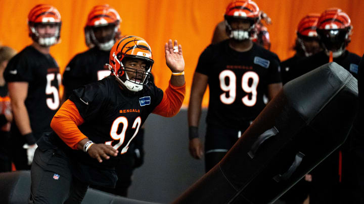 Cincinnati Bengals defensive tackle B.J. Hill (92) hits a pad at Bengals spring practice at the IEL Indoor Facility in Cincinnati on Tuesday, June 11, 2024.