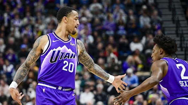 Utah Jazz forward/center John Collins (20) congratulates guard Collin Sexton (2) after a basket against the Washington
