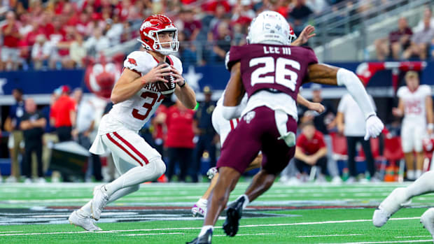 Arkansas Razorbacks punter Devin Bale (37) attempts a fake punt as Texas A&M Aggies defensive back Will Lee III (26) defends 