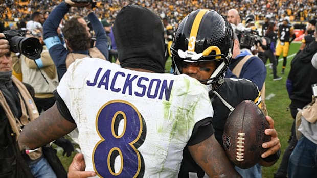  Pittsburgh Steelers quarterback Russell Wilson (3) hugs Baltimore Ravens quarterback Lamar Jackson (8) following a game.