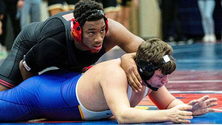 Fort Dodge's Dreshaun Ross (top) wrestles Johnston's Mason Roethler during the 215-pound semifinal match of the Ed Winger Invite at Urbandale High School on Saturday, Jan. 20, 2024, in Urbandale.
