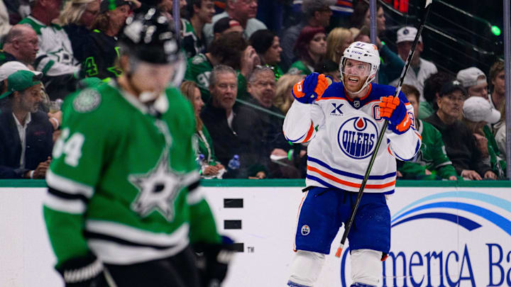 May 29, 2025; Dallas, Texas, USA; Edmonton Oilers center Connor McDavid (97) celebrates after he scores a goal against the Dallas Stars during the third period in game five of the Western Conference Final of the 2025 Stanley Cup Playoffs at American Airlines Center. Mandatory Credit: Jerome Miron-Imagn Images
