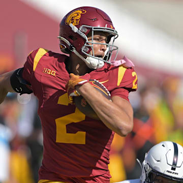 Oct 12, 2024; Los Angeles, California, USA;  USC Trojans wide receiver Duce Robinson (2) runs the ball after a complete pass before he is stopped by Penn State Nittany Lions safety Zakee Wheatley (6) in the second half at United Airlines Field at the Los Angeles Memorial Coliseum. Mandatory Credit: Jayne Kamin-Oncea-Imagn Images