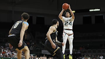 Dec 16, 2023; Coral Gables, Florida, USA; Miami Hurricanes guard Nijel Pack (24) shoots against the La Salle Explorers during the second half at Watsco Center. Mandatory Credit: Sam Navarro-Imagn Images