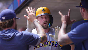 Jun 22, 2025; Minneapolis, Minnesota, USA; Milwaukee Brewers first base Rhys Hoskins (12) celebrates his run against the Minnesota Twins in the second inning at Target Field. Mandatory Credit: Brad Rempel-Imagn Images