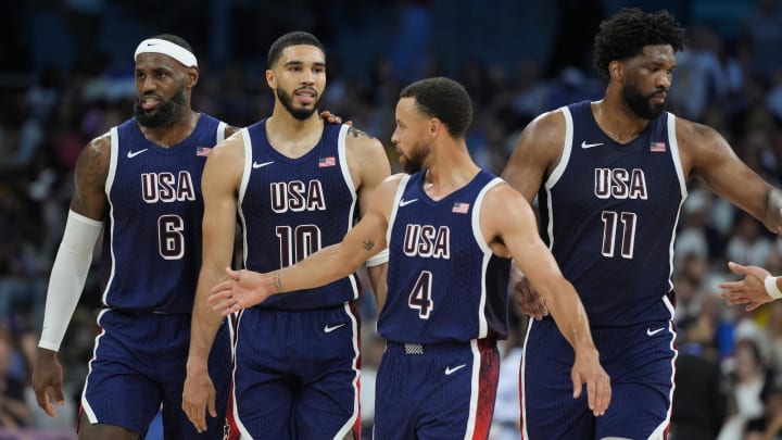 Aug 3, 2024; Villeneuve-d'Ascq, France; United States guard LeBron James (6), small forward Jayson Tatum (10), shooting guard Stephen Curry (4) and center Joel Embiid (11) in the second quarter against Puerto Rico during the Paris 2024 Olympic Summer Games at Stade Pierre-Mauroy. Mandatory Credit: John David Mercer-USA TODAY Sports