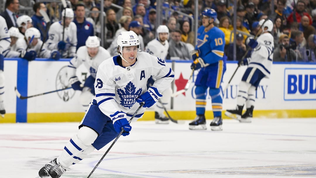 Nov 2, 2024; St. Louis, Missouri, USA;  Toronto Maple Leafs right wing Mitch Marner (16) controls the puck against the St. Louis Blues during the first period at Enterprise Center. Mandatory Credit: Jeff Curry-Imagn Images