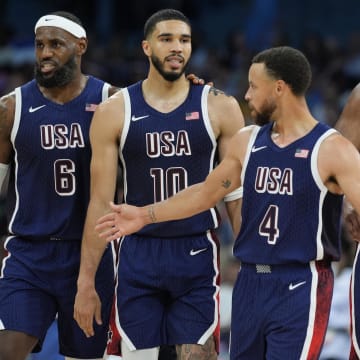 Aug 3, 2024; Villeneuve-d'Ascq, France; United States guard LeBron James (6), small forward Jayson Tatum (10), shooting guard Stephen Curry (4) and center Joel Embiid (11) in the second quarter against Puerto Rico during the Paris 2024 Olympic Summer Games at Stade Pierre-Mauroy. Mandatory Credit: John David Mercer-USA TODAY Sports