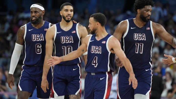 Aug 3, 2024; Villeneuve-d'Ascq, France; United States guard LeBron James (6), small forward Jayson Tatum (10), shooting guard Stephen Curry (4) and center Joel Embiid (11) in the second quarter against Puerto Rico during the Paris 2024 Olympic Summer Games at Stade Pierre-Mauroy. Mandatory Credit: John David Mercer-USA TODAY Sports