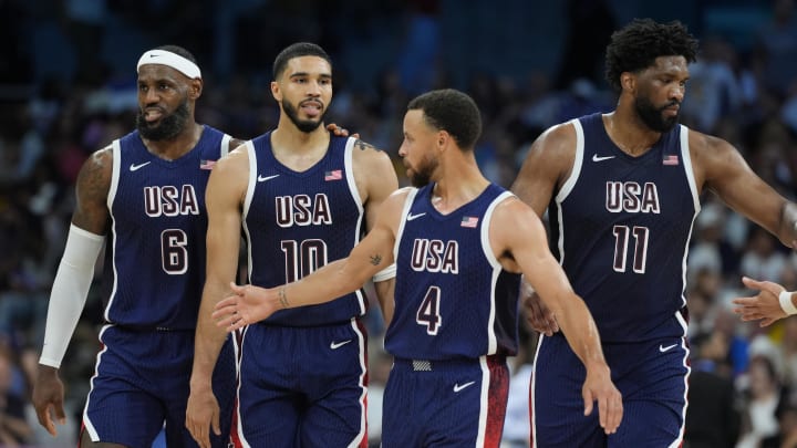 United States guard LeBron James (6), small forward Jayson Tatum (10), shooting guard Stephen Curry (4) and center Joel Embiid (11) in the second quarter against Puerto Rico during the Paris 2024 Olympic Summer Games at Stade Pierre-Mauroy. Mandatory Credit: