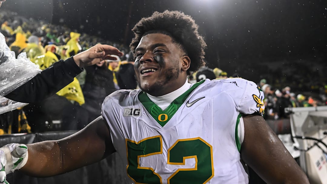 Nov 8, 2025; Iowa City, Iowa, USA; Oregon Ducks defensive lineman A'Mauri Washington (52) reacts with fans after the game against the Iowa Hawkeyes at Kinnick Stadium. Mandatory Credit: Jeffrey Becker-Imagn Images