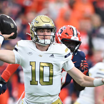 Sep 7, 2024; Syracuse, New York, USA; Georgia Tech Yellow Jackets quarterback Haynes King (10) throws a pass in the first quarter against the Syracuse Orange at JMA Wireless Dome. Mandatory Credit: Mark Konezny-Imagn Images