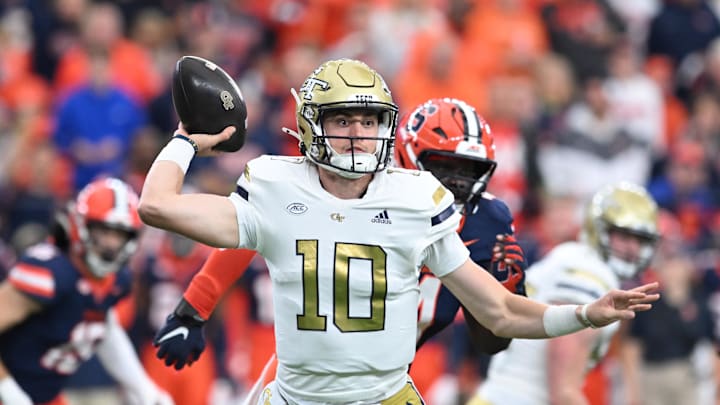 Sep 7, 2024; Syracuse, New York, USA; Georgia Tech Yellow Jackets quarterback Haynes King (10) throws a pass in the first quarter against the Syracuse Orange at JMA Wireless Dome. Mandatory Credit: Mark Konezny-Imagn Images