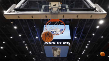 Mar 18, 2024; Dayton, OH, USA; General view of a March Madness basket ball falling through the net
