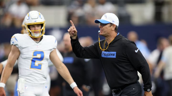 Aug 24, 2024; Arlington, Texas, USA; Los Angeles Chargers head coach Jim Harbaugh blows his whistle before the game against the Dallas Cowboys at AT&T Stadium. Mandatory Credit: Tim Heitman-USA TODAY Sports