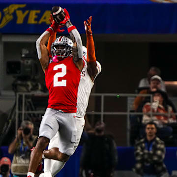 Ohio State receiver Emeka Egbuka (2) jumps for a catch during the College Football Playoff semifinal game against Texas.