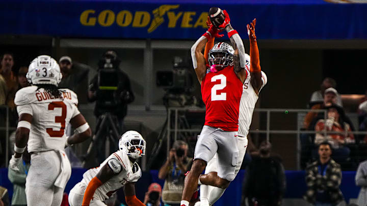 Ohio State receiver Emeka Egbuka (2) jumps for a catch during the College Football Playoff semifinal game against the Texas Longhorns in the Cotton Bowl at AT&T Stadium on Friday, Jan. 10, 2024 in Arlington, Texas.