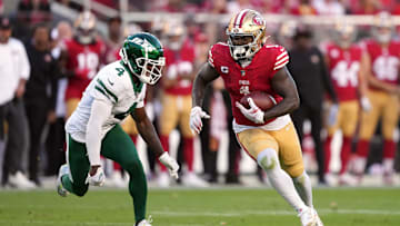 Sep 9, 2024; Santa Clara, California, USA; San Francisco 49ers wide receiver Deebo Samuel Sr. (right) runs after a catch against New York Jets cornerback D.J. Reed (4) during the second quarter at Levi's Stadium. Mandatory Credit: Darren Yamashita-Imagn Images