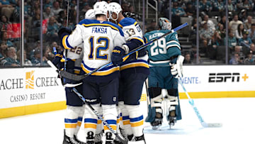 Oct 10, 2024; San Jose, California, USA;  St. Louis Blues center Radek Faksa (12) celebrates with his teammates during the third period against the San Jose Sharks at SAP Center at San Jose. Mandatory Credit: Stan Szeto-Imagn Images
