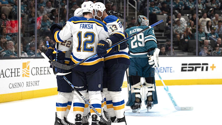 Oct 10, 2024; San Jose, California, USA;  St. Louis Blues center Radek Faksa (12) celebrates with his teammates during the third period against the San Jose Sharks at SAP Center at San Jose. Mandatory Credit: Stan Szeto-Imagn Images