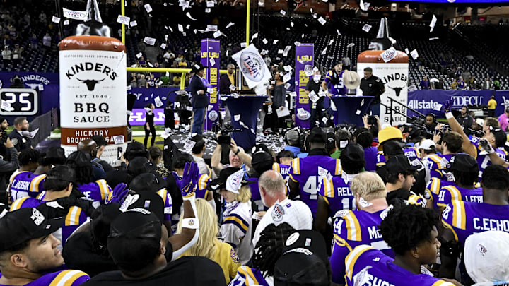 The LSU Tigers celebrate at NRG Stadium. The Tigers defeat the Bears 44-31 in a college football game The LSU Tigers celebrate at NRG Stadium. The Tigers defeat the Bears 44-31 in a college football game