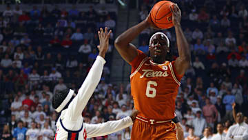 Jan 29, 2025; Oxford, Mississippi, USA; Texas Longhorns forward Arthur Kaluma (6) handles the ball as Mississippi Rebels guard Jaylen Murray (5) defends during the first half at The Sandy and John Black Pavilion at Ole Miss. Mandatory Credit: Petre Thomas-Imagn Images