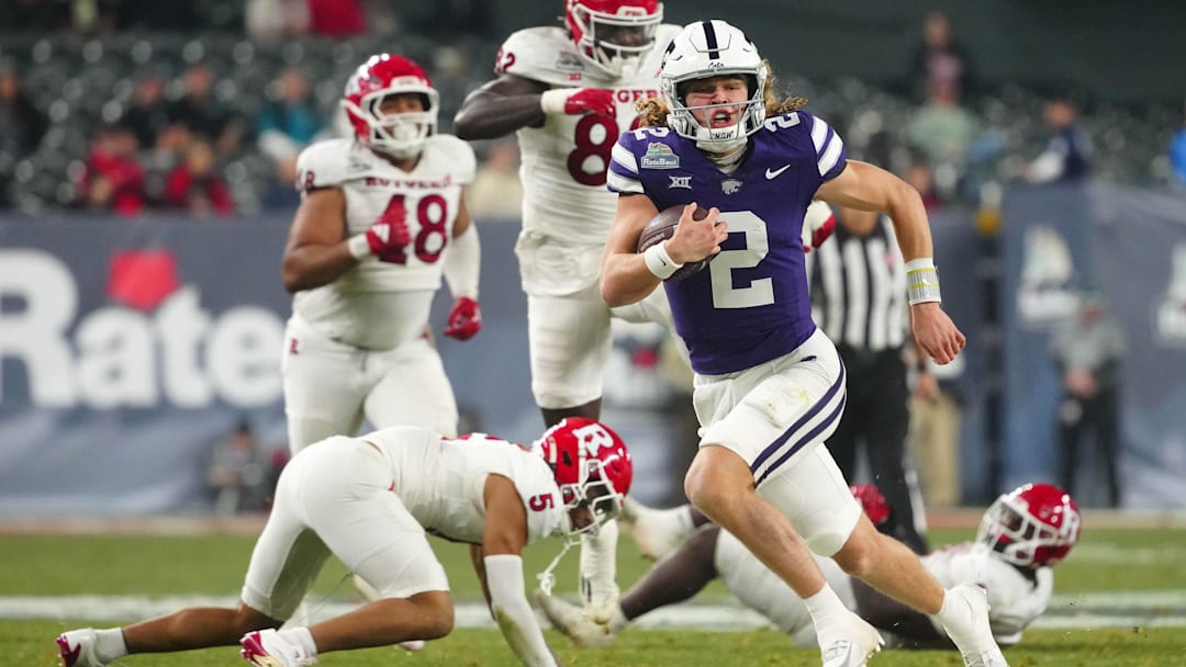 Kansas State quarterback Avery Johnson (2) scrambles against Rutgers during second half of the Rate Bowl at Chase Field on Dec. 26, 2024, in Phoenix.