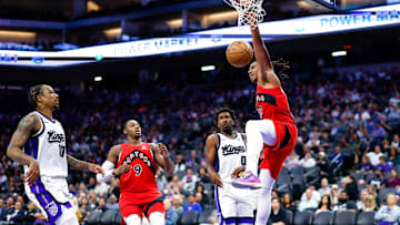 Oct 8, 2025; Sacramento, California, USA; Toronto Raptors forward Collin Murray-Boyles (12) dunks the ball during the third quarter against the Sacramento Kings at Golden 1 Center. Mandatory Credit: Sergio Estrada-Imagn Images