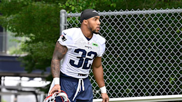 Jun 9, 2025; Foxborough, MA, USA; New England Patriots running back TreVeyon Henderson (32) walks to the practice fields at Gillette Stadium. Mandatory Credit: Eric Canha-Imagn Images