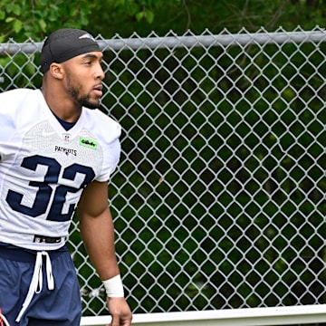 Jun 9, 2025; Foxborough, MA, USA; New England Patriots running back TreVeyon Henderson (32) walks to the practice fields at Gillette Stadium. Mandatory Credit: Eric Canha-Imagn Images