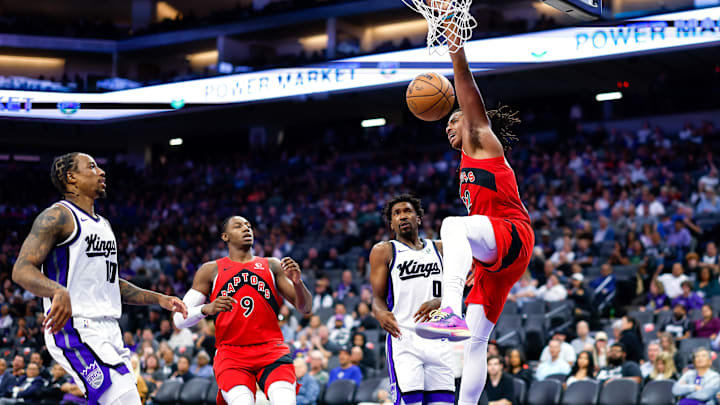 Oct 8, 2025; Sacramento, California, USA; Toronto Raptors forward Collin Murray-Boyles (12) dunks the ball during the third quarter against the Sacramento Kings at Golden 1 Center. Mandatory Credit: Sergio Estrada-Imagn Images