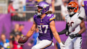 Sep 21, 2025; Minneapolis, Minnesota, USA; Minnesota Vikings tight end TJ. Hockenson (87) catches a touchdown pass against the Cincinnati Bengals during the second half at U.S. Bank Stadium.