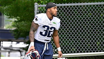 Jun 9, 2025; Foxborough, MA, USA; New England Patriots running back TreVeyon Henderson (32) walks to the practice fields at Gillette Stadium. Mandatory Credit: Eric Canha-Imagn Images
