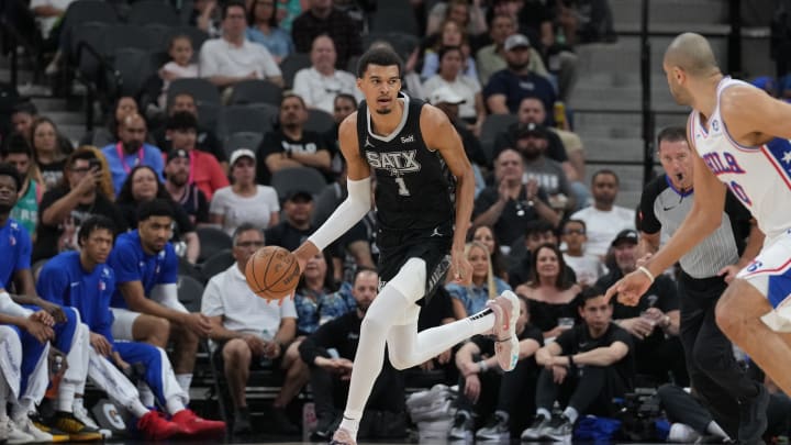 Apr 7, 2024; San Antonio, Texas, USA; San Antonio Spurs center Victor Wembanyama (1) dribbles in the first half against the Philadelphia 76ers at Frost Bank Center. 