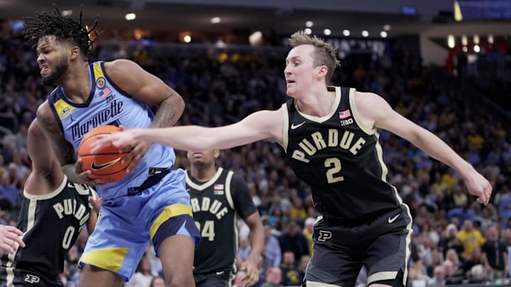 Purdue guard Fletcher Loyer (2) strips the ball from Marquette forward David Joplin (23) Purdue guard Fletcher Loyer (2) strips the ball from Marquette forward David Joplin (23)