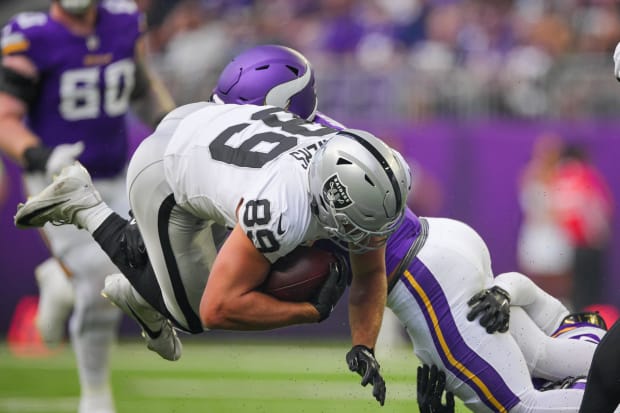 Las Vegas Raiders tight end Brock Bowers is tackled in a preseason game against the Minnesota Vikings.