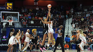 Jul 6, 2025; Uncasville, Connecticut, USA; The Connecticut Sun and Las Vegas Aces tip-off to start the game at Mohegan Sun Arena. Mandatory Credit: David Butler II-Imagn Images
