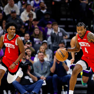 Jan 16, 2025; Sacramento, California, USA; Houston Rockets guard Jalen Green (4) dribbles the ball up the court against Sacramento Kings guard Malik Monk (0) during the fourth quarter at Golden 1 Center. Mandatory Credit: Sergio Estrada-Imagn Images
