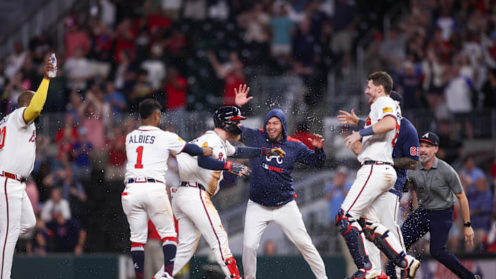 May 12, 2025; Atlanta, Georgia, USA; Atlanta Braves left fielder Alex Verdugo (8) celebrates with second baseman Ozzie Albies (1) and shortstop Orlando Arcia (11) and catcher Sean Murphy (12) after a walk-off single against the Washington Nationals at Truist Park. Mandatory Credit: Brett Davis-Imagn Images

