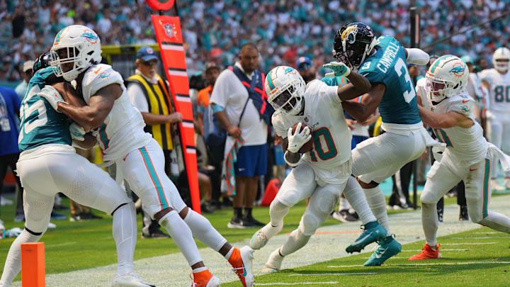 Sep 8, 2024; Miami Gardens, Florida, USA;  Jacksonville Jaguars cornerback Tyson Campbell (3) drives Miami Dolphins wide receiver Tyreek Hill (10) out of bounds in the second quarter at Hard Rock Stadium. Mandatory Credit: Jim Rassol-Imagn Images