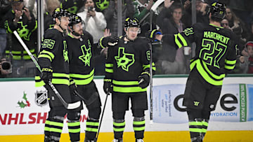 Nov 29, 2024; Dallas, Texas, USA; Dallas Stars defenseman Thomas Harley (55) and center Tyler Seguin (91) and right wing Evgenii Dadonov (63) and left wing Mason Marchment (27) celebrate a power play goal scored by Seguin against the Colorado Avalanche during the first period at the American Airlines Center. Mandatory Credit: Jerome Miron-Imagn Images