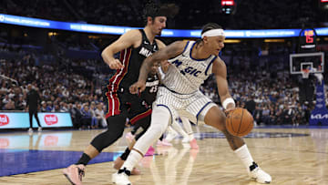 Oct 22, 2025; Orlando, Florida, USA; Orlando Magic forward Paolo Banchero (5) is guarded by Miami Heat forward Jaime Jaquez Jr. (11) in the fourth quarter at Kia Center. Mandatory Credit: Nathan Ray Seebeck-Imagn Images
