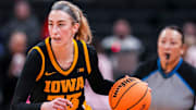 Iowa Hawkeyes guard Lucy Olsen (33) brings the ball up the court Friday, March 7, 2025, in a quarterfinals game at the 2025 TIAA Big Ten Women's Basketball Tournament between the Iowa Hawkeyes and the Ohio State Buckeyes at Gainbridge Fieldhouse in Indianapolis.