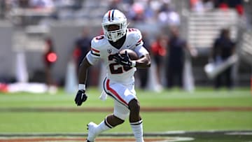 Sep 3, 2022; San Diego, California, USA; Arizona Wildcats running back Rayshon Luke (20) runs the ball against the San Diego State Aztecs during the first half at Snapdragon Stadium. Mandatory Credit: Orlando Ramirez-Imagn Images