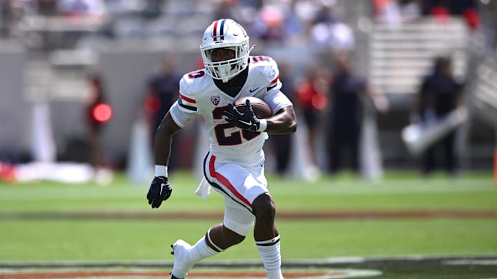 Sep 3, 2022; San Diego, California, USA; Arizona Wildcats running back Rayshon Luke (20) runs the ball against the San Diego State Aztecs during the first half at Snapdragon Stadium. Mandatory Credit: Orlando Ramirez-USA TODAY Sports